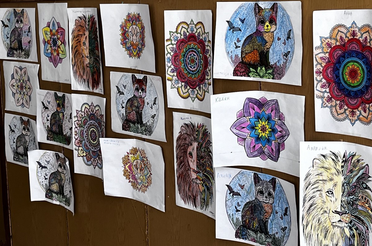 Childrens drawings displayed outside of their classroom.